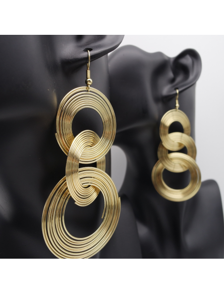 Gold circle ear stud on three floors