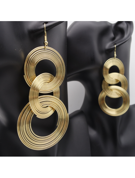 Gold circle ear stud on three floors